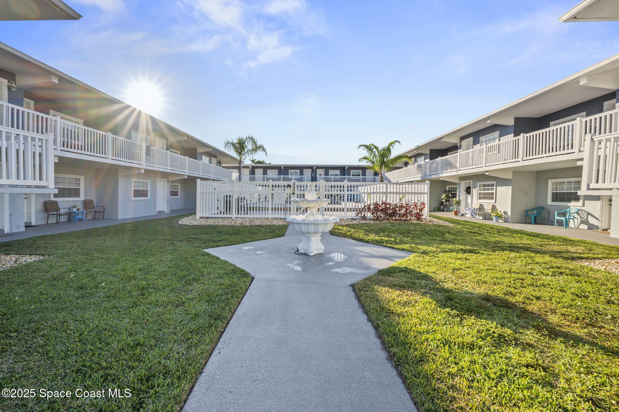 1170 South Patrick Drive, Unit 29 Satellite Beach, FL 32937 - Photo 4 of 18 a view of a house with a swimming pool