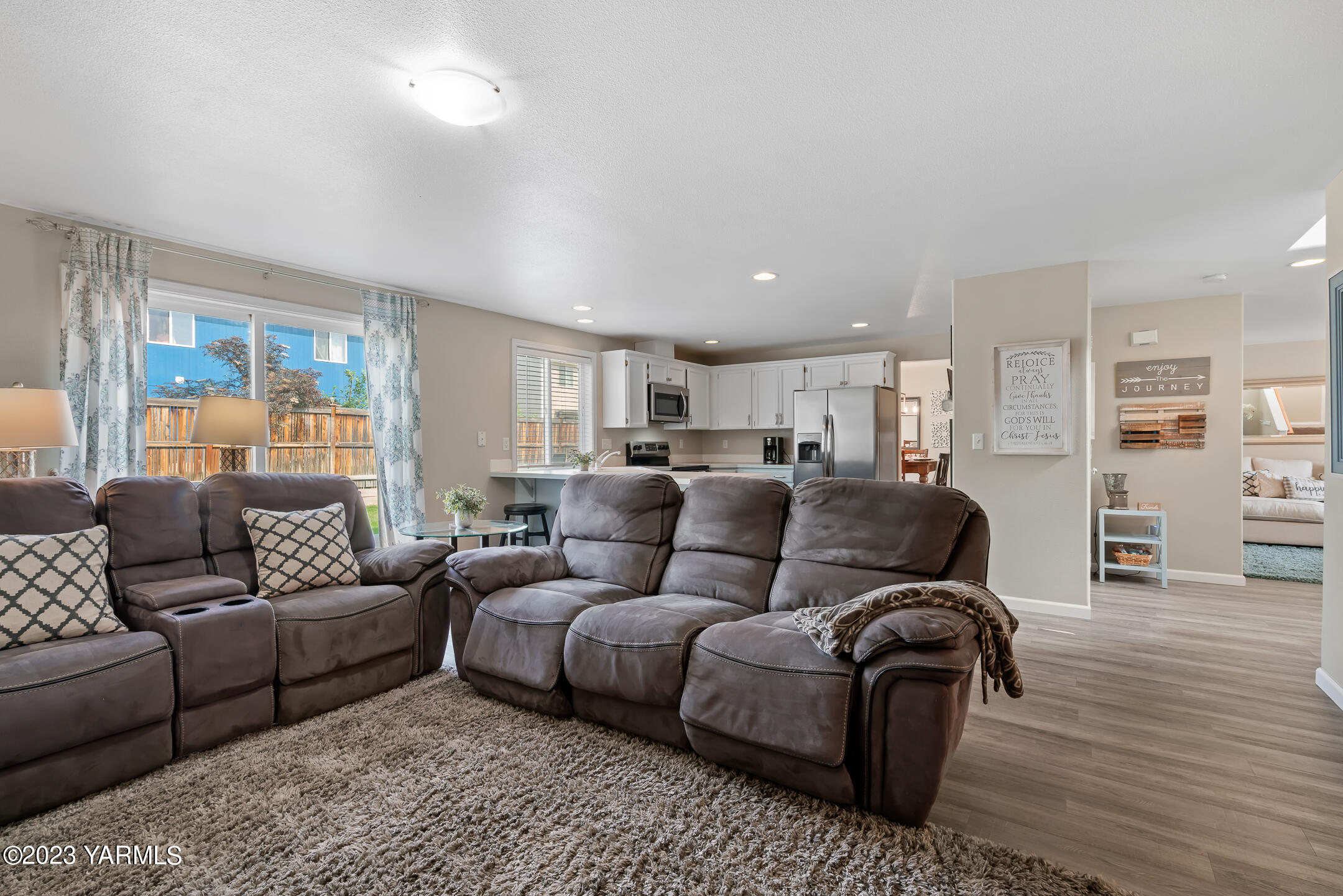 213 Perle Street Moxee, WA 98936 - Photo 11 of 27 a living room with furniture and a wooden floor