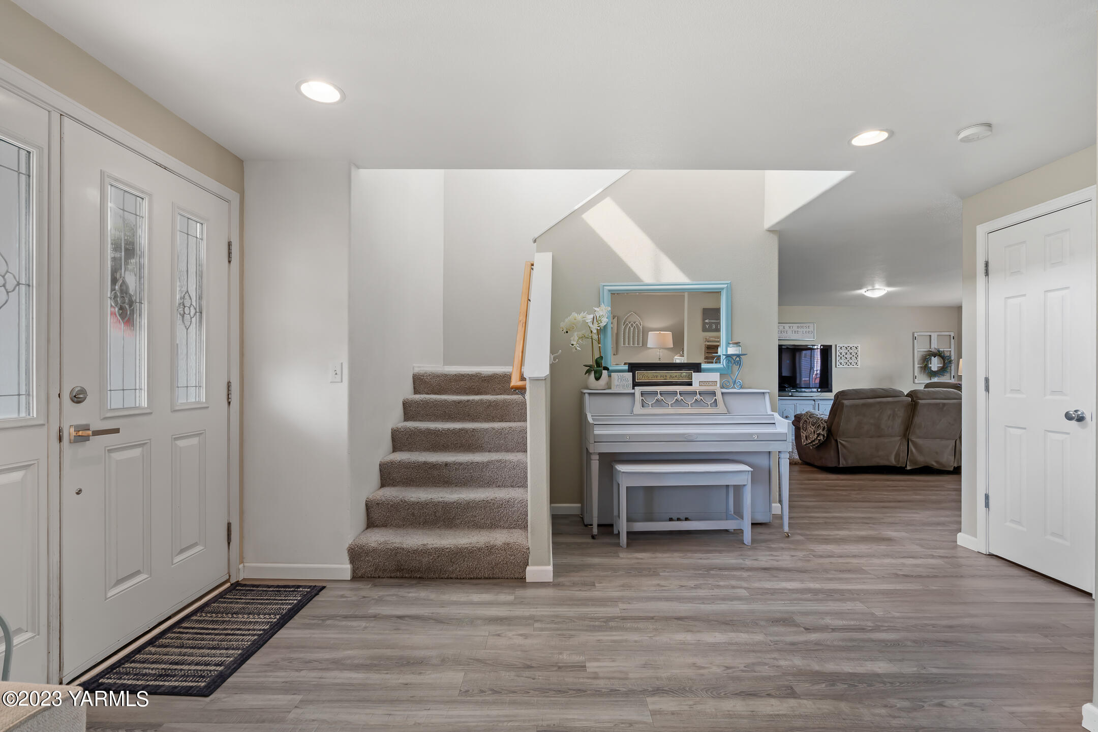 213 Perle Street Moxee, WA 98936 - Photo 15 of 27 a view of a room with wooden floor and furniture