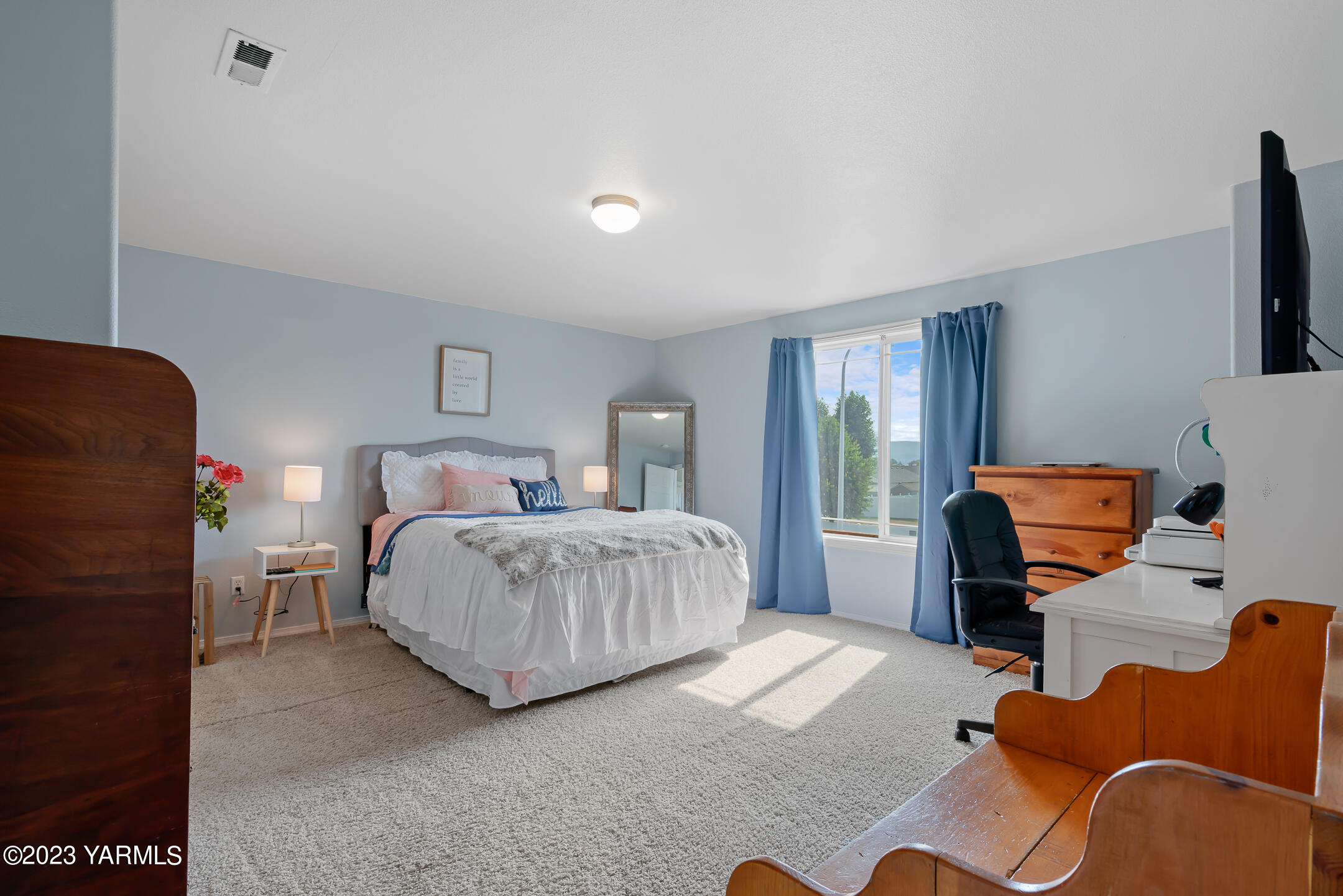 213 Perle Street Moxee, WA 98936 - Photo 16 of 27 a bedroom with a bed and wooden floor