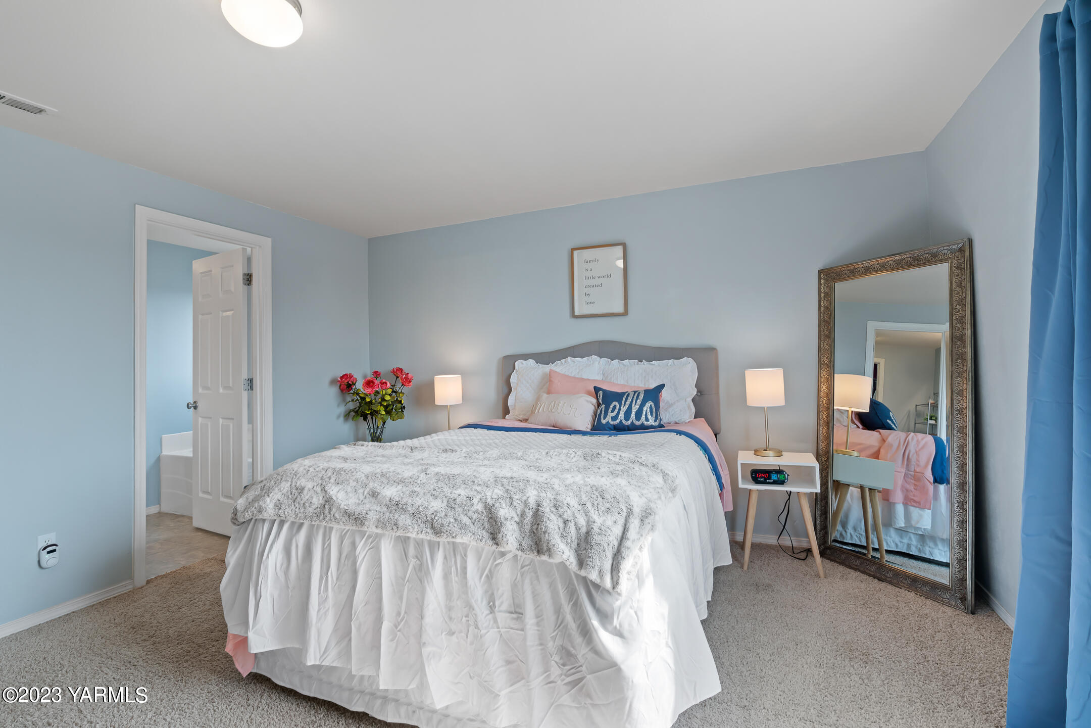 213 Perle Street Moxee, WA 98936 - Photo 17 of 27 a bedroom with a bed and a potted plant