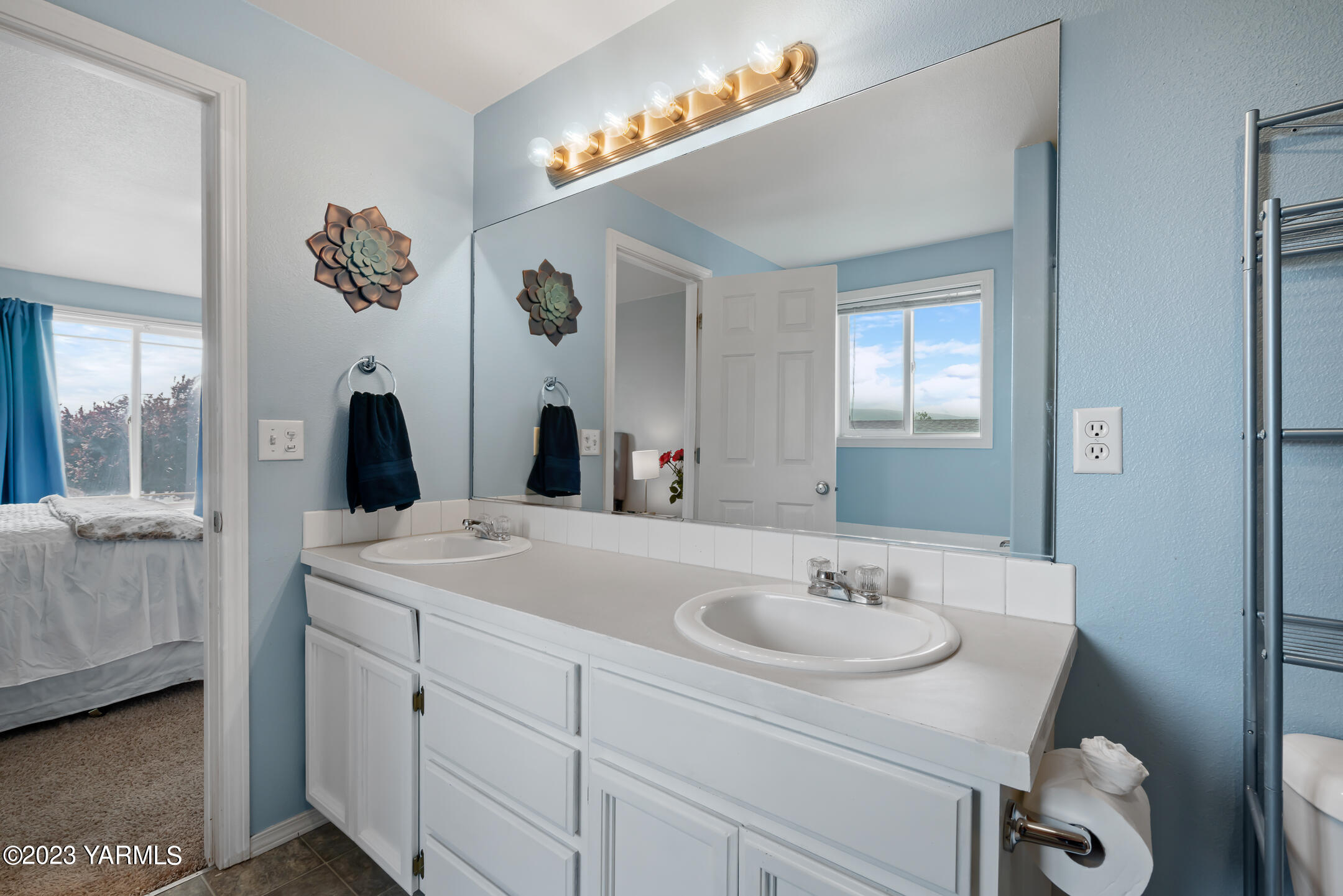 213 Perle Street Moxee, WA 98936 - Photo 18 of 27 a bathroom with a sink and a mirror