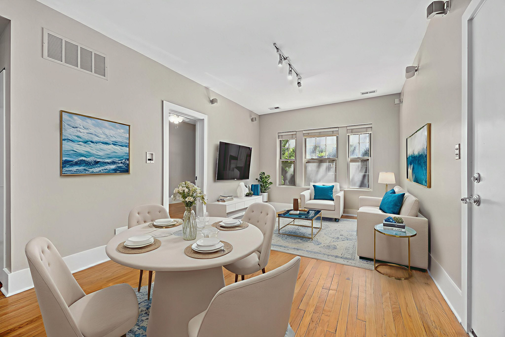 3418 North Wolcott Avenue, Unit 1N Chicago, IL 60657 - Photo 4 of 16 a living room with furniture kitchen view and a large window