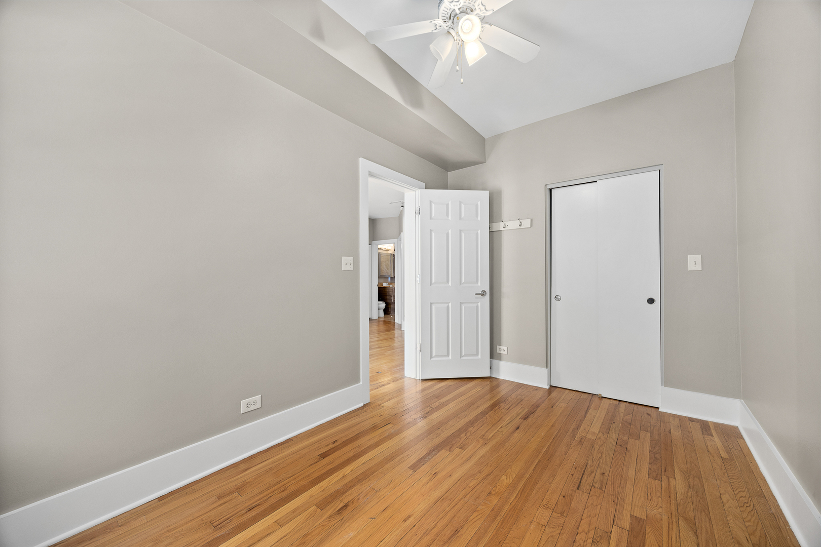 3418 North Wolcott Avenue, Unit 1N Chicago, IL 60657 - Photo 9 of 16 a view of an empty room with wooden floor