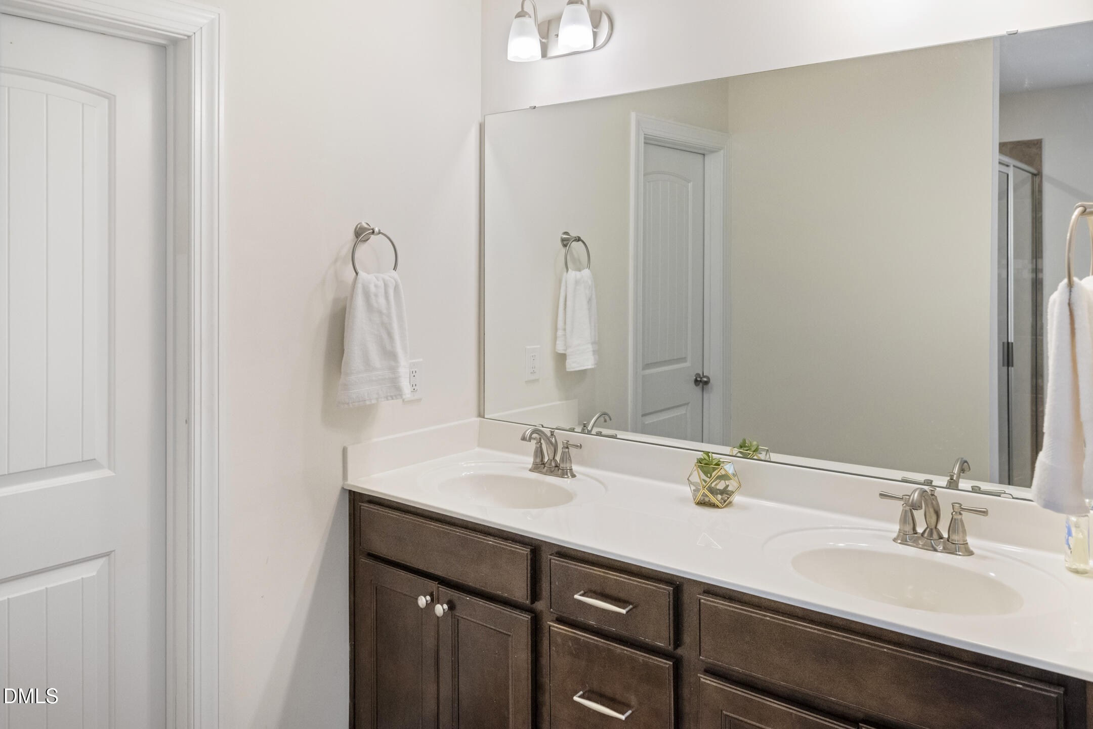 3541 Fairstone Road Wake Forest, NC 27587 - Photo 22 of 39 a bathroom with a double vanity sink and a mirror