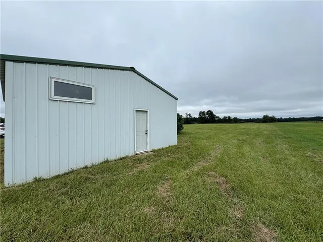 a view of outdoor space with deck and yard