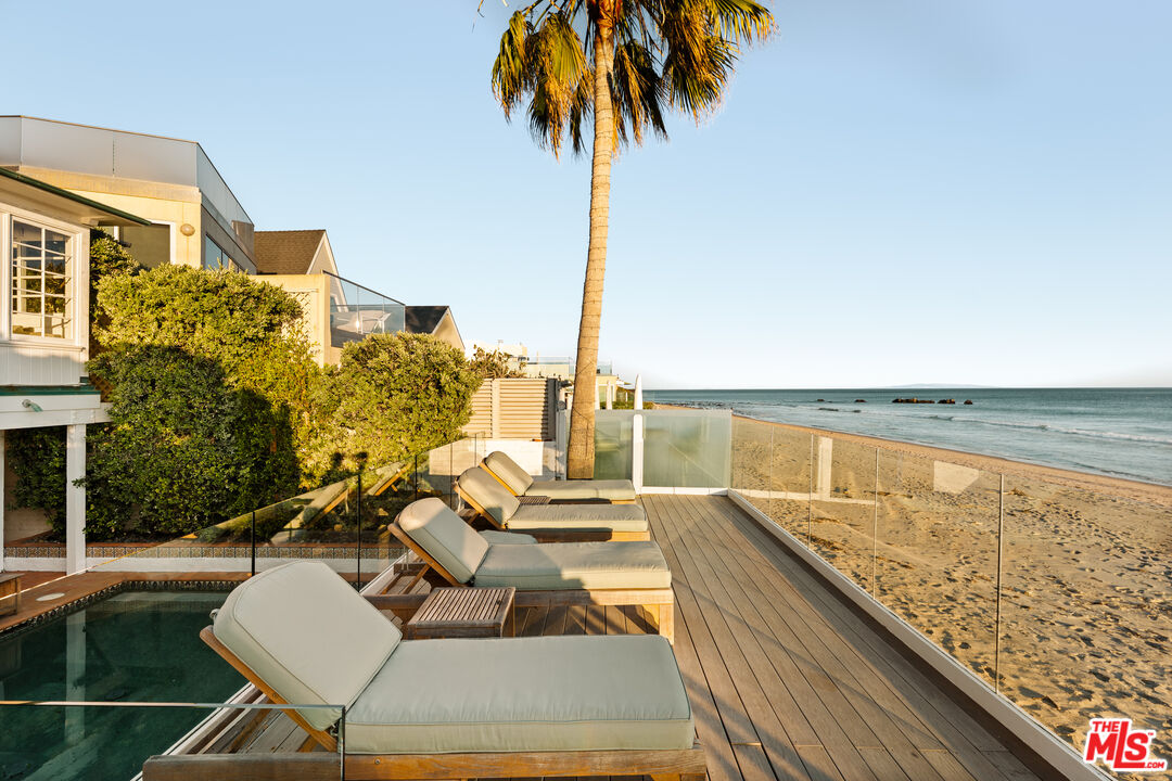 23422 Malibu Colony Road, Unit 98 Malibu, CA 90265 - Photo 25 of 42 a terrace with outdoor seating and city view