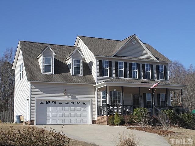282 Saddle Ridge Drive Willow Spring, NC 27592 - Photo 2 of 23 a front view of a house with yard