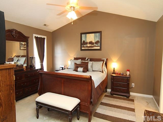 282 Saddle Ridge Drive Willow Spring, NC 27592 - Photo 12 of 23 a bedroom with a bed and a dresser