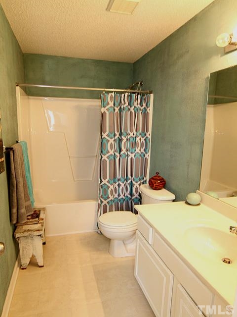 282 Saddle Ridge Drive Willow Spring, NC 27592 - Photo 19 of 23 a bathroom with a sink toilet and shower