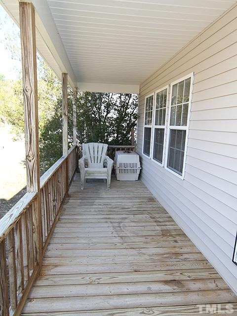 282 Saddle Ridge Drive Willow Spring, NC 27592 - Photo 20 of 23 a balcony with wooden floor and furniture