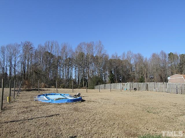282 Saddle Ridge Drive Willow Spring, NC 27592 - Photo 22 of 23 a view of outdoor space with trees