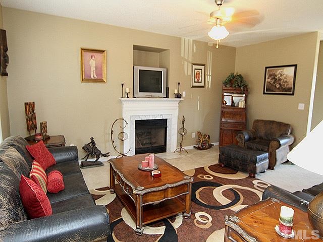 282 Saddle Ridge Drive Willow Spring, NC 27592 - Photo 6 of 23 a living room with furniture fireplace and flat screen tv