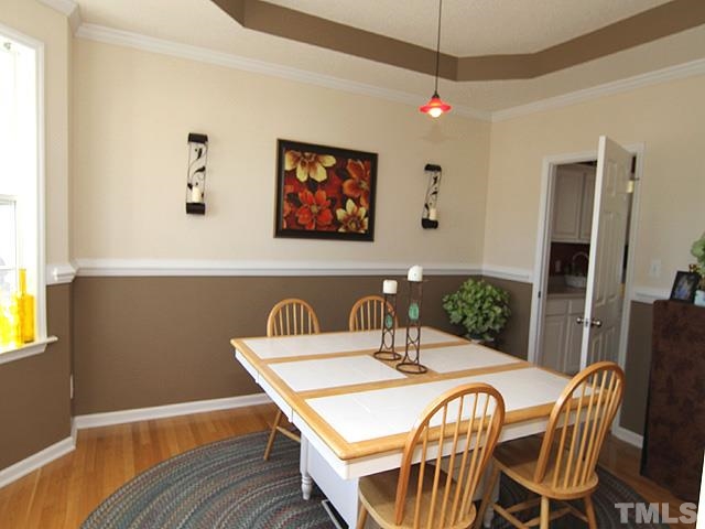 282 Saddle Ridge Drive Willow Spring, NC 27592 - Photo 7 of 23 a view of a dining room with furniture and wooden floor
