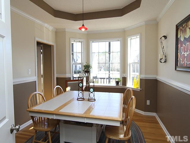 282 Saddle Ridge Drive Willow Spring, NC 27592 - Photo 8 of 23 a view of a dining room with furniture window and outside view