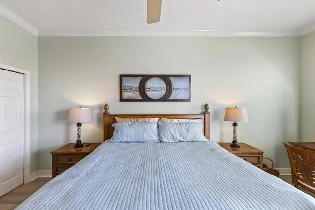 a bedroom with a bed and a night stand