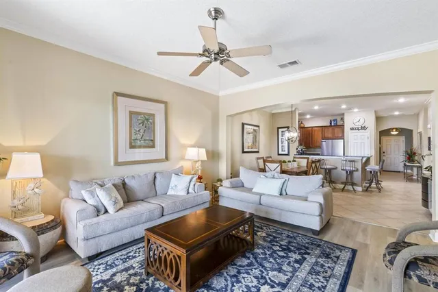 a living room with furniture and a lamp