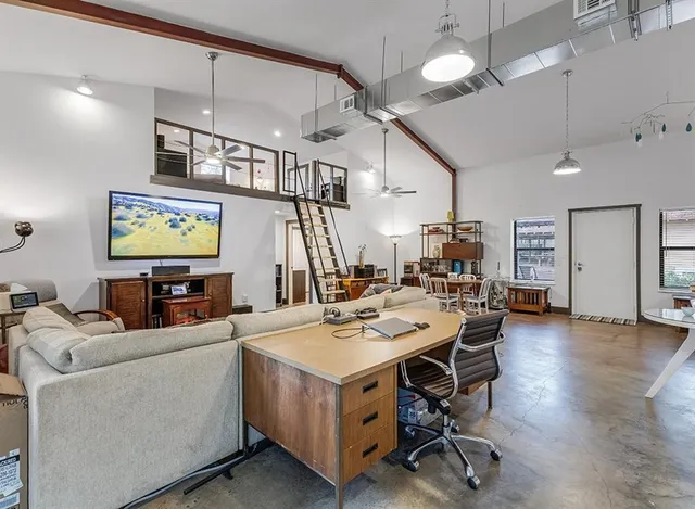 a work room with furniture and wooden floor