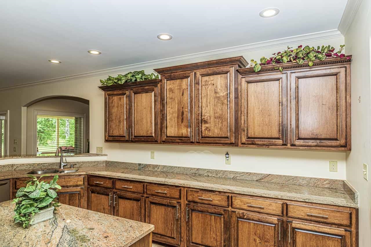185 Belmont Road Mason, TN 38049 - Photo 25 of 38 Kitchen featuring wood cabinetry, granite countertops, an undermount sink, and recessed lighting