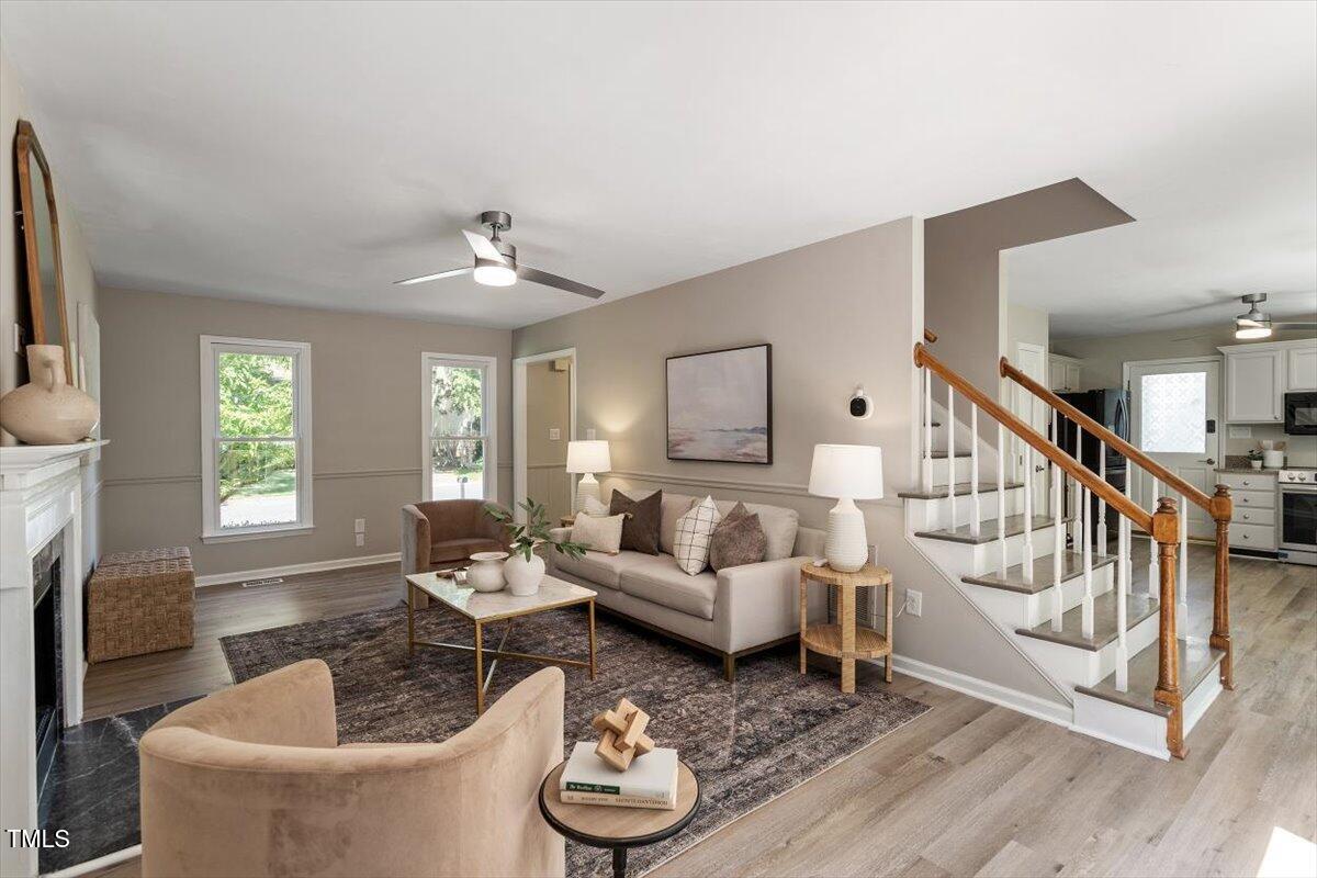 4714 Lazyriver Drive Durham, NC 27712 - Photo 11 of 37 a living room with furniture and a fireplace