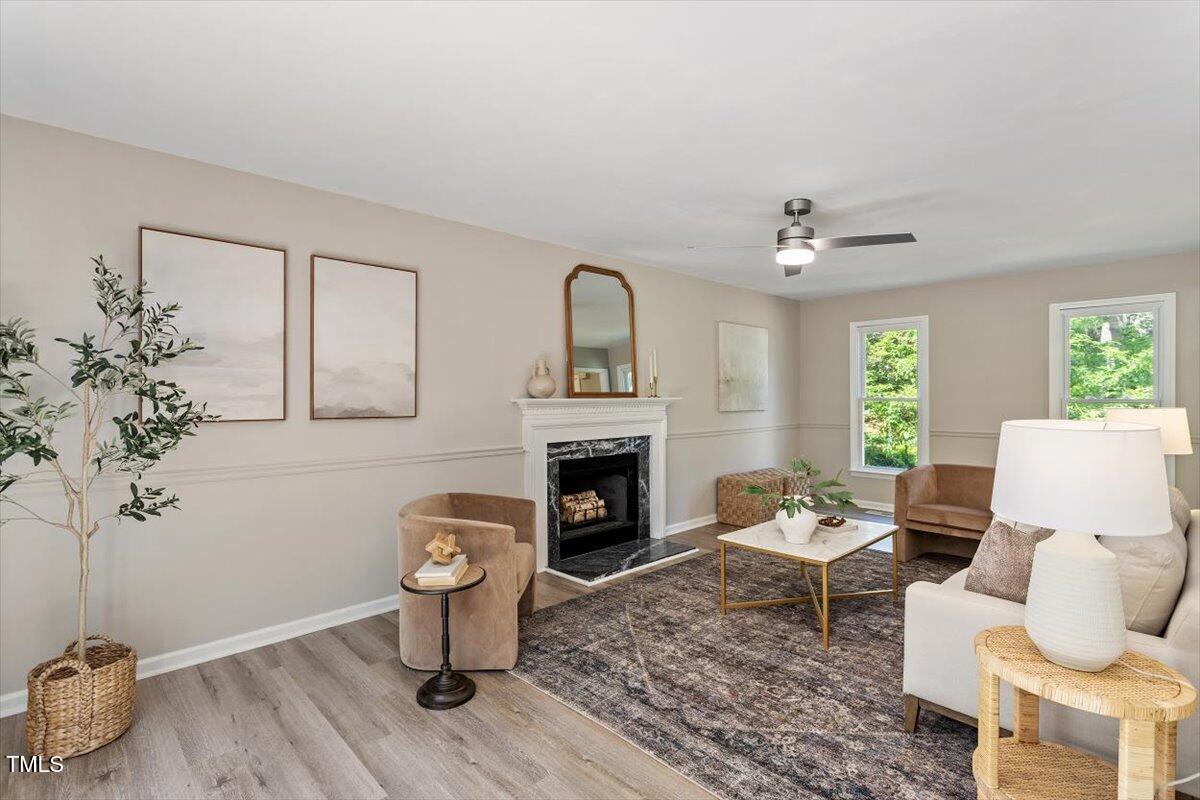 4714 Lazyriver Drive Durham, NC 27712 - Photo 12 of 37 a living room with furniture and a fireplace