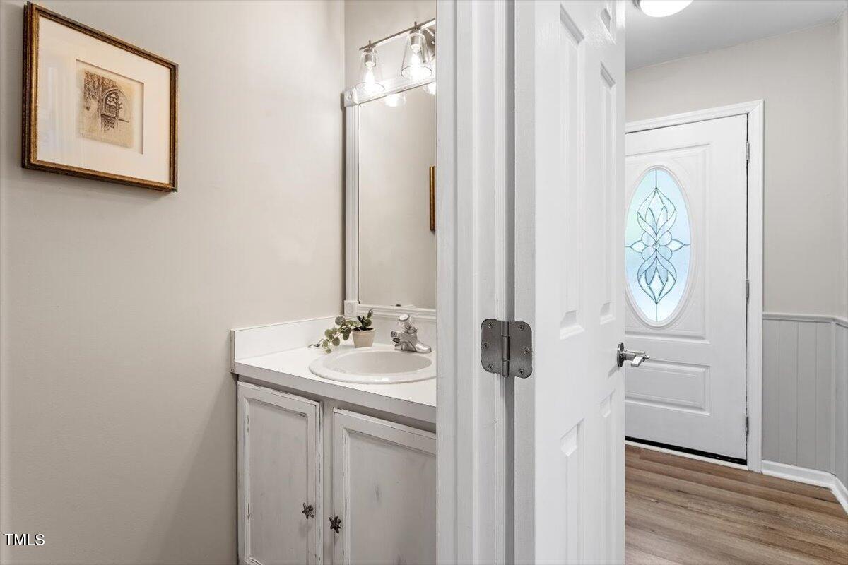 4714 Lazyriver Drive Durham, NC 27712 - Photo 14 of 37 a bathroom with a sink and a mirror