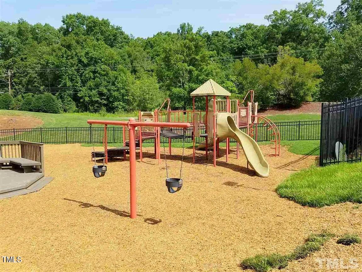 4714 Lazyriver Drive Durham, NC 27712 - Photo 18 of 37 a view of a park with swings