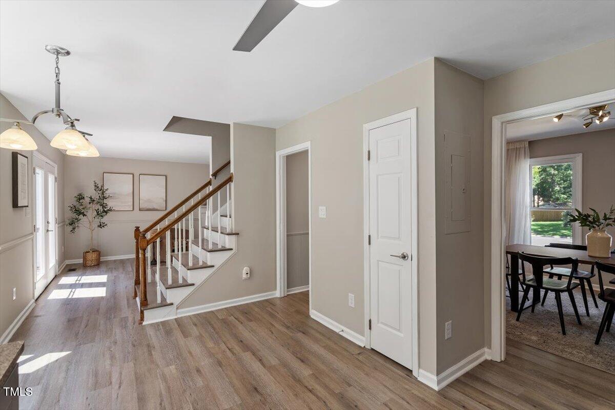 4714 Lazyriver Drive Durham, NC 27712 - Photo 19 of 37 a view of entryway with wooden floor and stairs