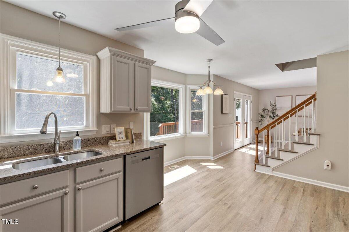 4714 Lazyriver Drive Durham, NC 27712 - Photo 20 of 37 a kitchen with sink cabinets and window