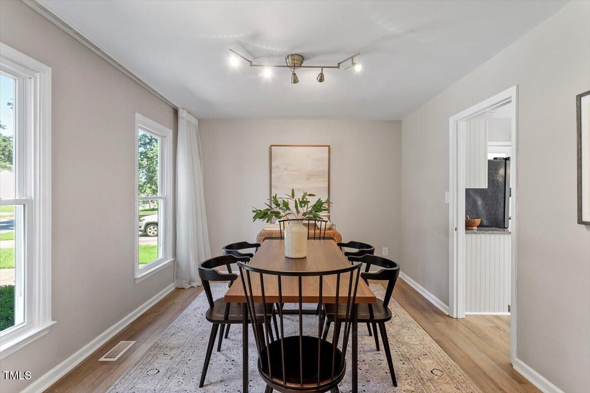 4714 Lazyriver Drive Durham, NC 27712 - Photo 3 of 37 a dining room with furniture and window