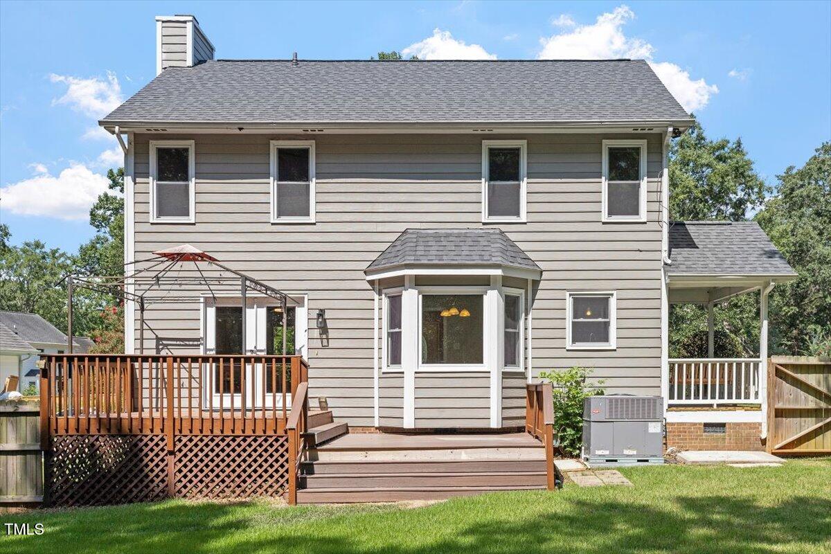 4714 Lazyriver Drive Durham, NC 27712 - Photo 32 of 37 a front view of a house with a garden