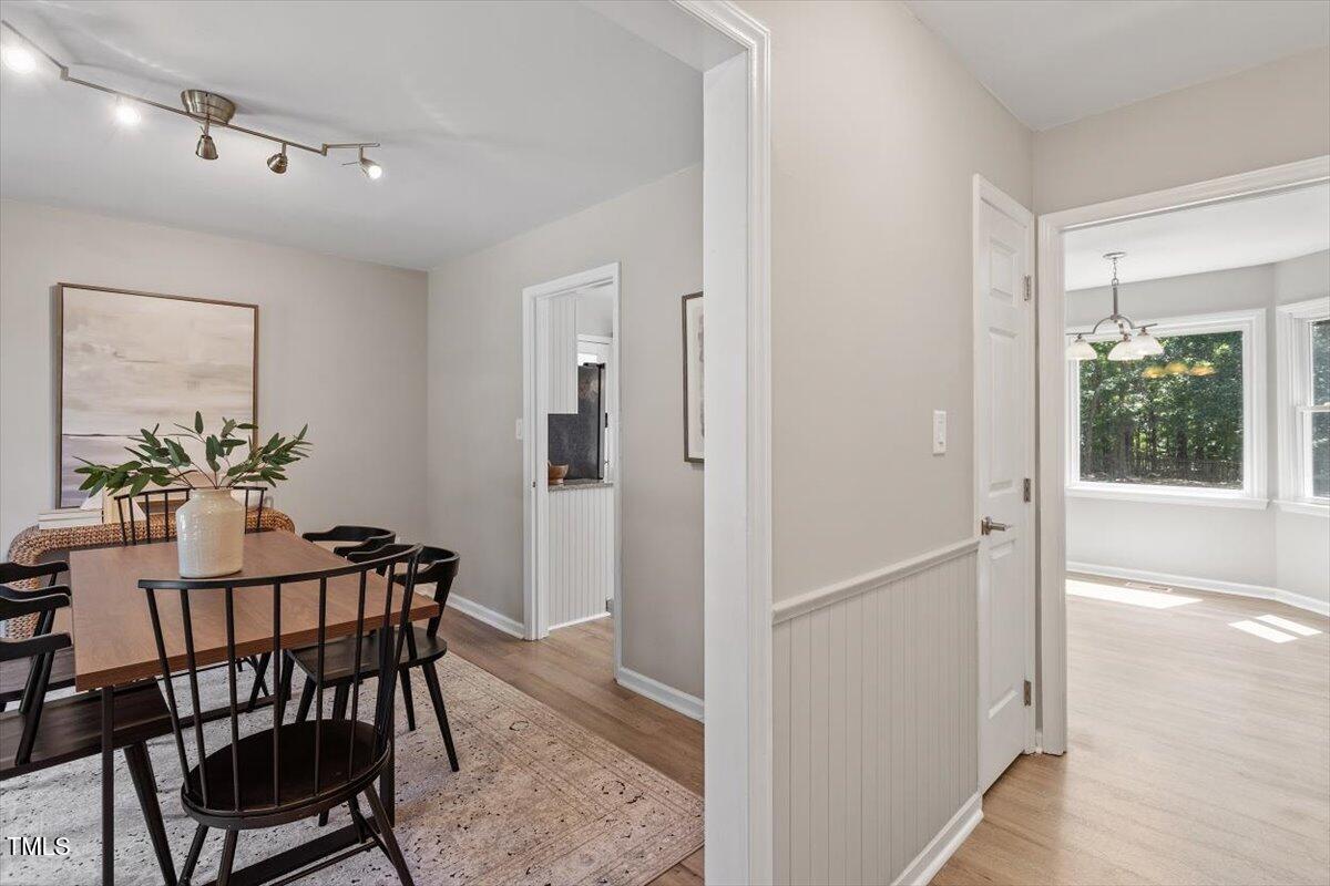 4714 Lazyriver Drive Durham, NC 27712 - Photo 4 of 37 a view of a dining room with furniture window and wooden floor