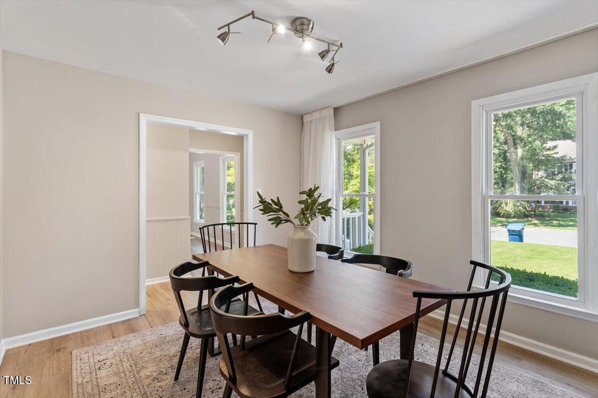 4714 Lazyriver Drive Durham, NC 27712 - Photo 6 of 37 a view of a dining room with furniture window and outside view