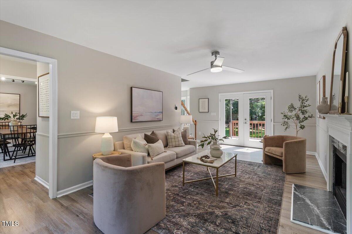 4714 Lazyriver Drive Durham, NC 27712 - Photo 7 of 37 a living room with furniture and a fireplace