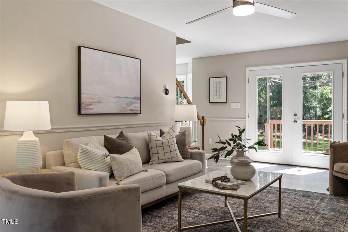 4714 Lazyriver Drive Durham, NC 27712 - Photo 10 of 37 a living room with furniture and a large window