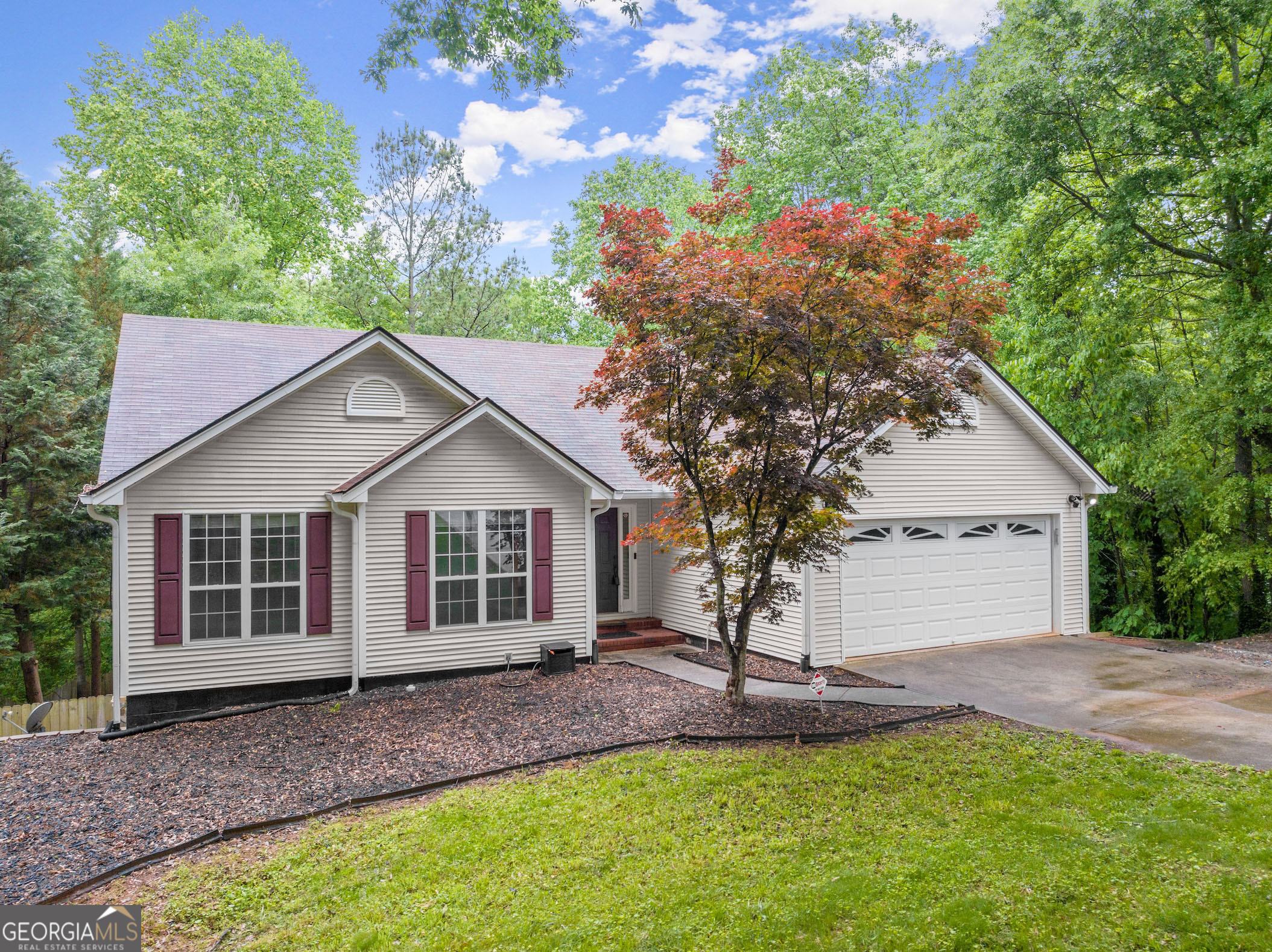 4267 Riviere Point Gainesville, GA 30507 - Photo 1 of 1 a view of a house with a yard and large tree