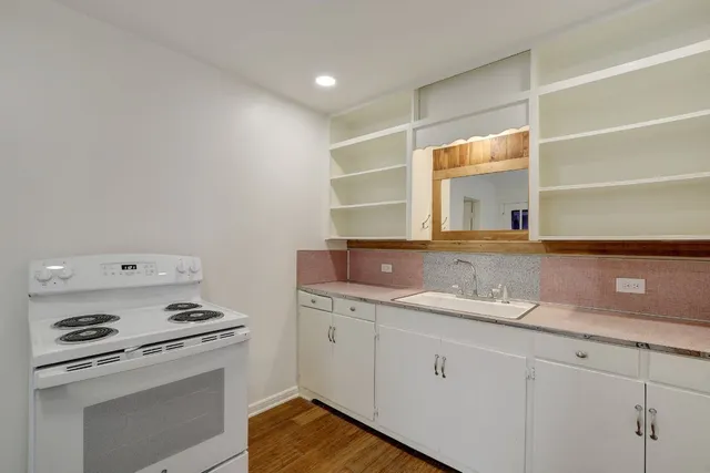 a view of cabinets with wooden floor