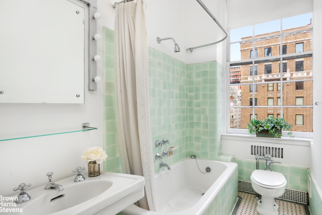 1001 Park Avenue, Unit 11 Manhattan, NY 10028 - Photo 11 of 17 a bathroom with a sink toilet bathtub and shower