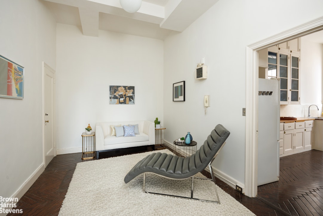 1001 Park Avenue, Unit 11 Manhattan, NY 10028 - Photo 16 of 17 a bedroom with furniture and a window