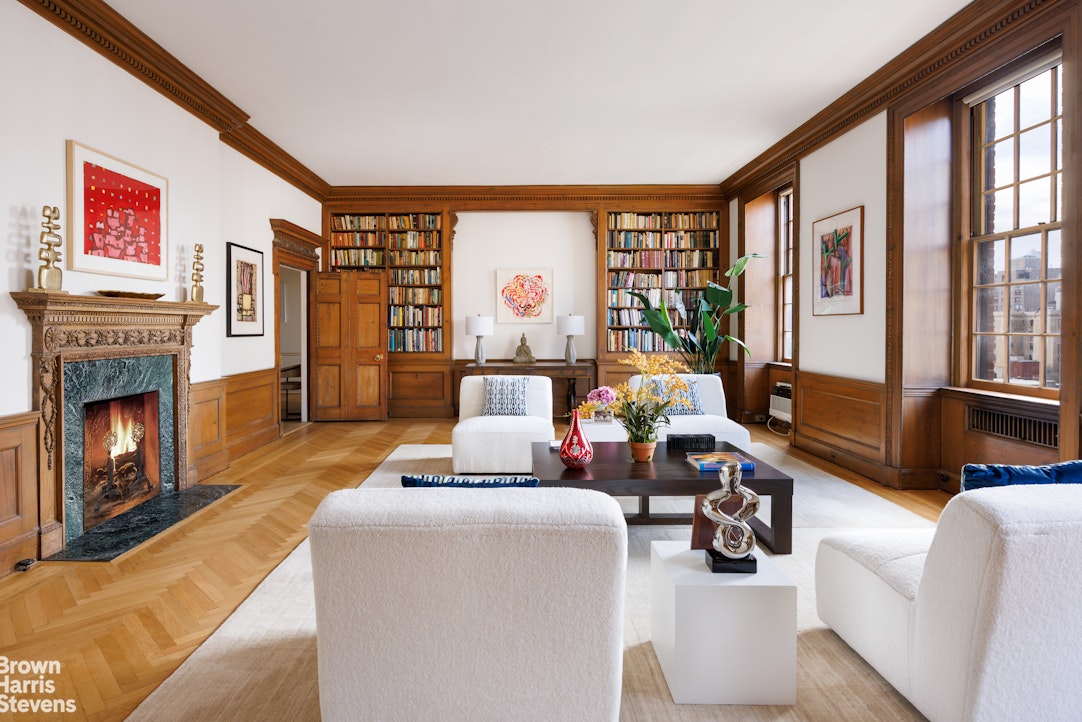 1001 Park Avenue, Unit 11 Manhattan, NY 10028 - Photo 3 of 17 a living room with furniture and a fireplace