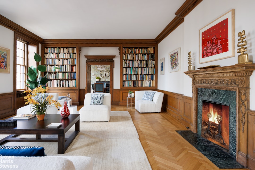 1001 Park Avenue, Unit 11 Manhattan, NY 10028 - Photo 4 of 17 a living room with furniture and a fireplace