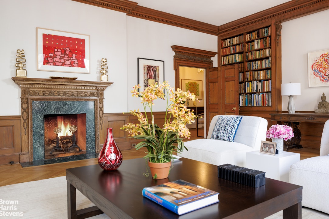 1001 Park Avenue, Unit 11 Manhattan, NY 10028 - Photo 5 of 17 a living room with furniture and a fireplace