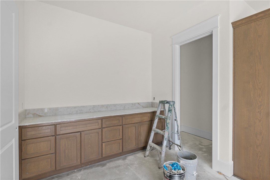 3026 Silverbell Court Bryan, TX 77807 - Photo 22 of 30 a room with cabinets and utility