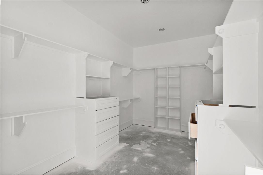 3026 Silverbell Court Bryan, TX 77807 - Photo 24 of 30 a view of storage and utility room with cabinet dryer and washer