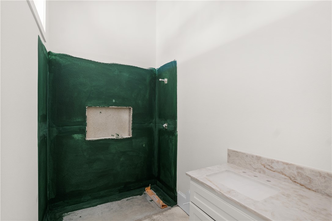 3026 Silverbell Court Bryan, TX 77807 - Photo 26 of 30 a bathroom with a shower