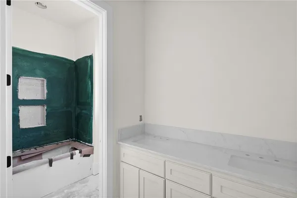 a view of an empty room with a window