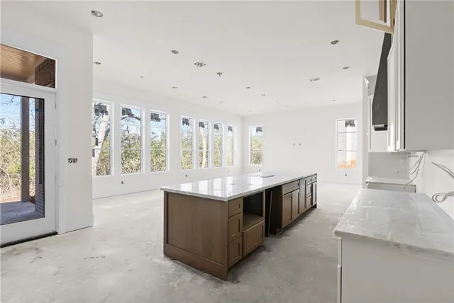 a kitchen with stainless steel appliances granite countertop a stove and a sink