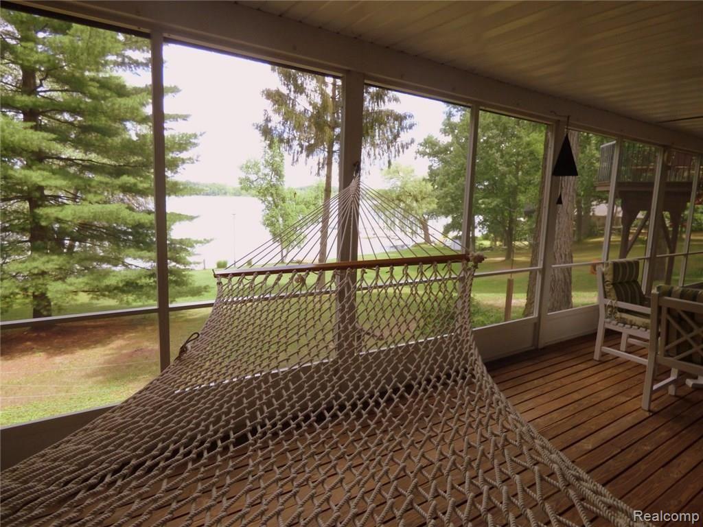 350 Bruin Lake Road Gregory, MI 48137 - Photo 32 of 35 24 SCREENED IN PORCH WITH VIEW.JPG