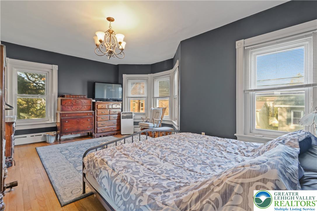 225 South Walnut Street Bath, PA 18014 - Photo 12 of 20 a bedroom with a bed and dresser with window
