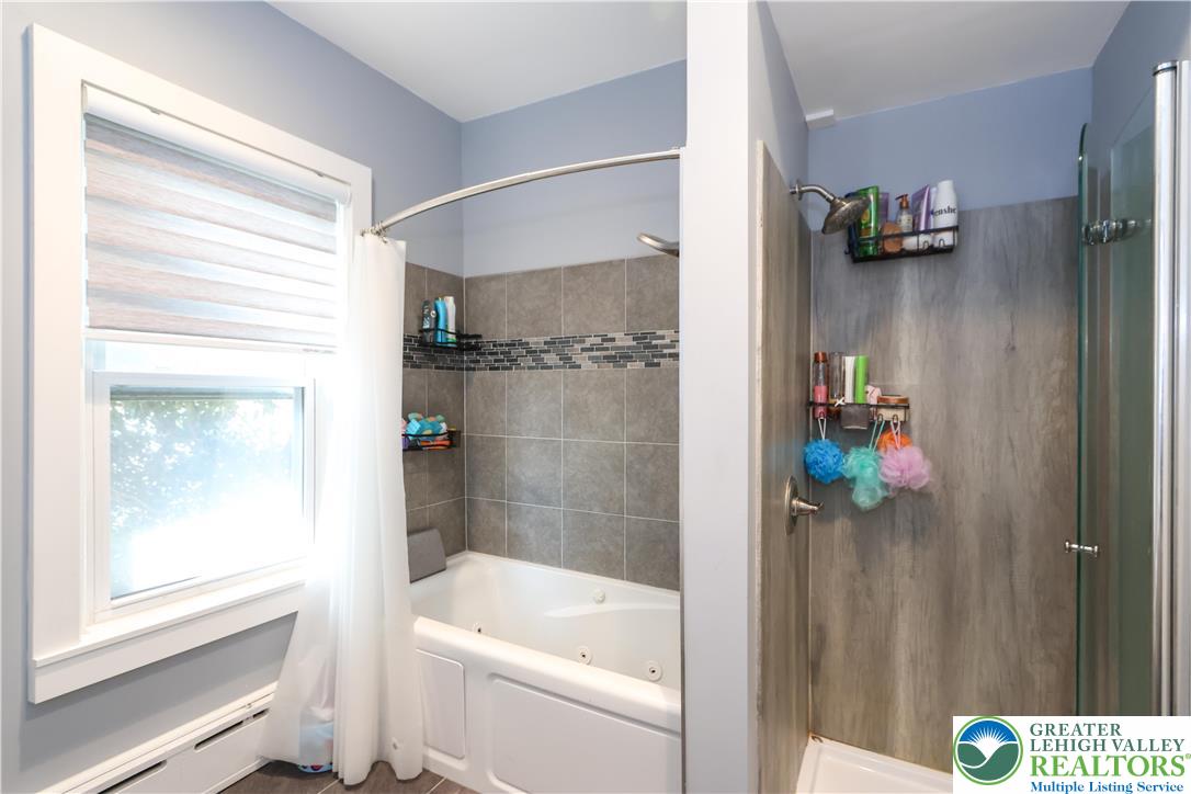 225 South Walnut Street Bath, PA 18014 - Photo 16 of 20 a bathroom with a shower and a tub